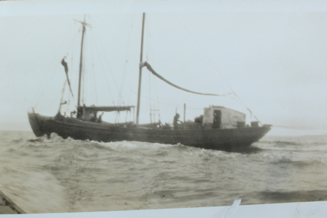 Skipper Din Pat Walsh is shown here leaving Merasheen to fish off Cape St. Mary’s on the M.V Glider, owned by W.W.Wareham &amp;amp; Sons Ltd., Harbour Buffett. On the bottom left corner of the photo is a skiff called Sheena manned by John and Ernie Walsh. Skipper Din Pat made many voyages to Golden Bay to engage in the trap fishery from 1930-1960. Din Pat skippered the “M.V. Glider “for four full fishing seasons from 1945 to 1949, April to October. Some of the crew men from Merasheen were: Jim Gardiner, Johnny Barnett, Mickie Connors, Jim Barry, Leo Pomroy, Mickie Corcoran, Jim Connors, Bill Barnett, Din Pat Gardiner, Jack Barry, and Lar Pitcher. Walsh’s cousin, Lar Walsh from Beckford’s Cove just inside Presque, was a crewmember as well. When they returned home after each trip one would often see them sit around together and talk about their voyage in between a laugh and perhaps a song in the spirit of comradeship is the parlor, stage or store loft.
According to Ernie, the forty-two ton Glider in just one fishing season brought in 2300 quintals and in another season caught 1800 quintals of codfish. We should remember now that this was not all fun and pleasure. It was hard work and dangerous too. Both Stan Bennett from Isle Valen and Skipper Din Pat Walsh, fishing the Glider on the Grand Banks in 1949, had to ride out a storm for eleven days.&amp;nbsp;
The banker Glider was acquired by Merchant W.J.Bursey in early in 1952. He hired Din Pat Walsh as skipper. They fished out of Bay Bulls carrying eleven crewmen and four dories to fish off St. Mary's, Cape Pine, St. Mary's Banks and adjacent areas. The first voyage for the season was in April and in just three days her crew secured 40,000 pounds of prime cod and flounder. The Bursey fishing operations have two focal points - the premises at Bay Bulls where the fish was landed and filleted, and the plant at Fort Amherst in St. John's Harbour, where it was further processed, packed, frozen and from which it is shipped to the New York market. The first trip of the Glider represented the first fish to be processed at the plants that year and the work on plants meant a great deal to workers, crewmembers, and families in the surrounding areas.
In the Fall of 1949 , Skipper Din Pat let his young son Ernie come aboard with him, as he brought crewmen back home to Presque, Isle au Valen and Clattice Harbour.&amp;nbsp; Ernie recalls, “For about ten minutes coming back to Merasheen, he let me get behind the wheel and steer for the point on the compass. As a six year old, this was indeed a big deal. I don't remember seeing anyone else in the pilot house, but I'm sure father was behind me. Being excited when I landed, there were lots to tell my school buddies come Monday morning.”